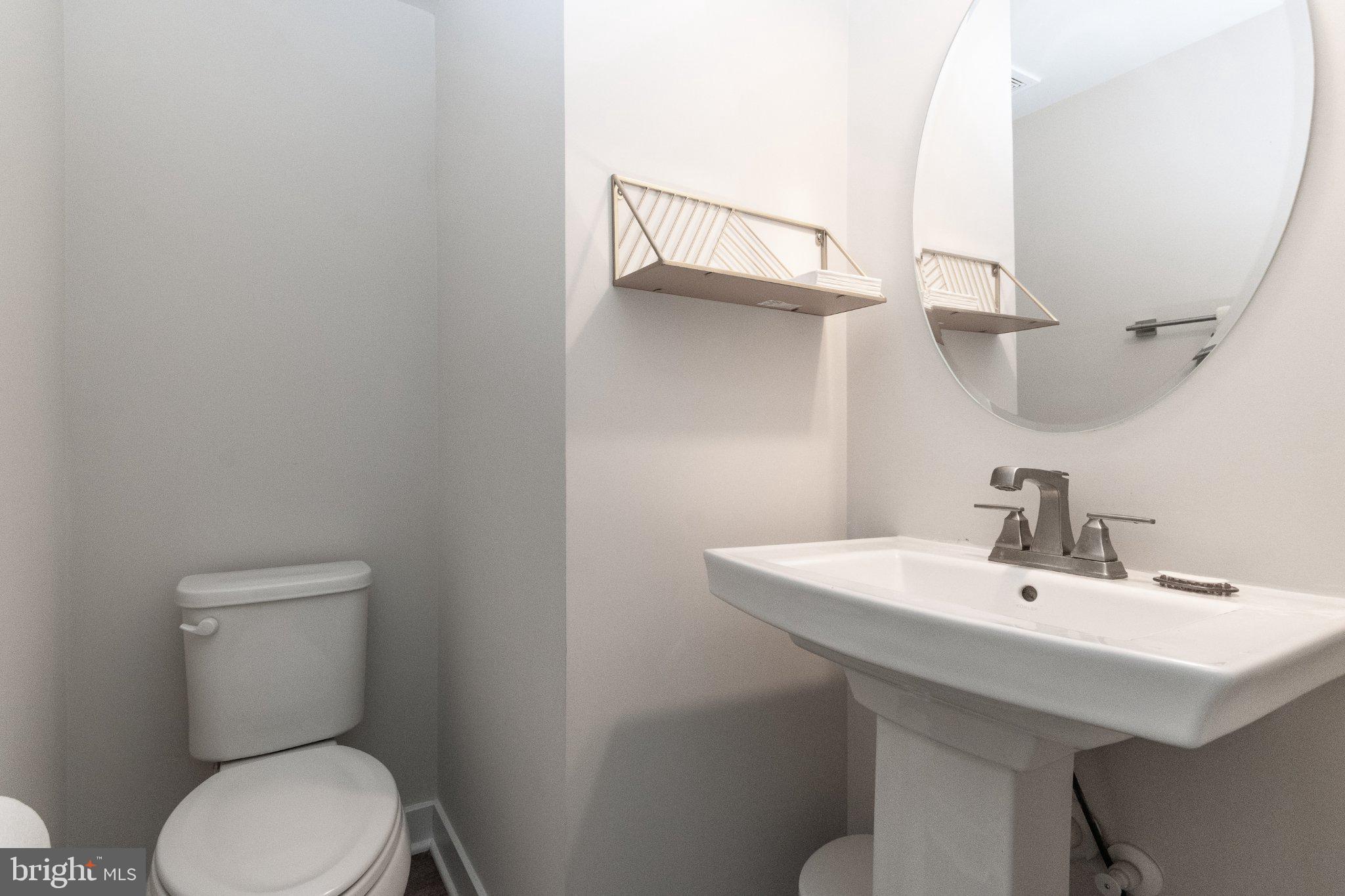 109 Blantons Road Martinsburg, WV 25405 - Photo 13 of 55 a bathroom with a toilet a sink and mirror