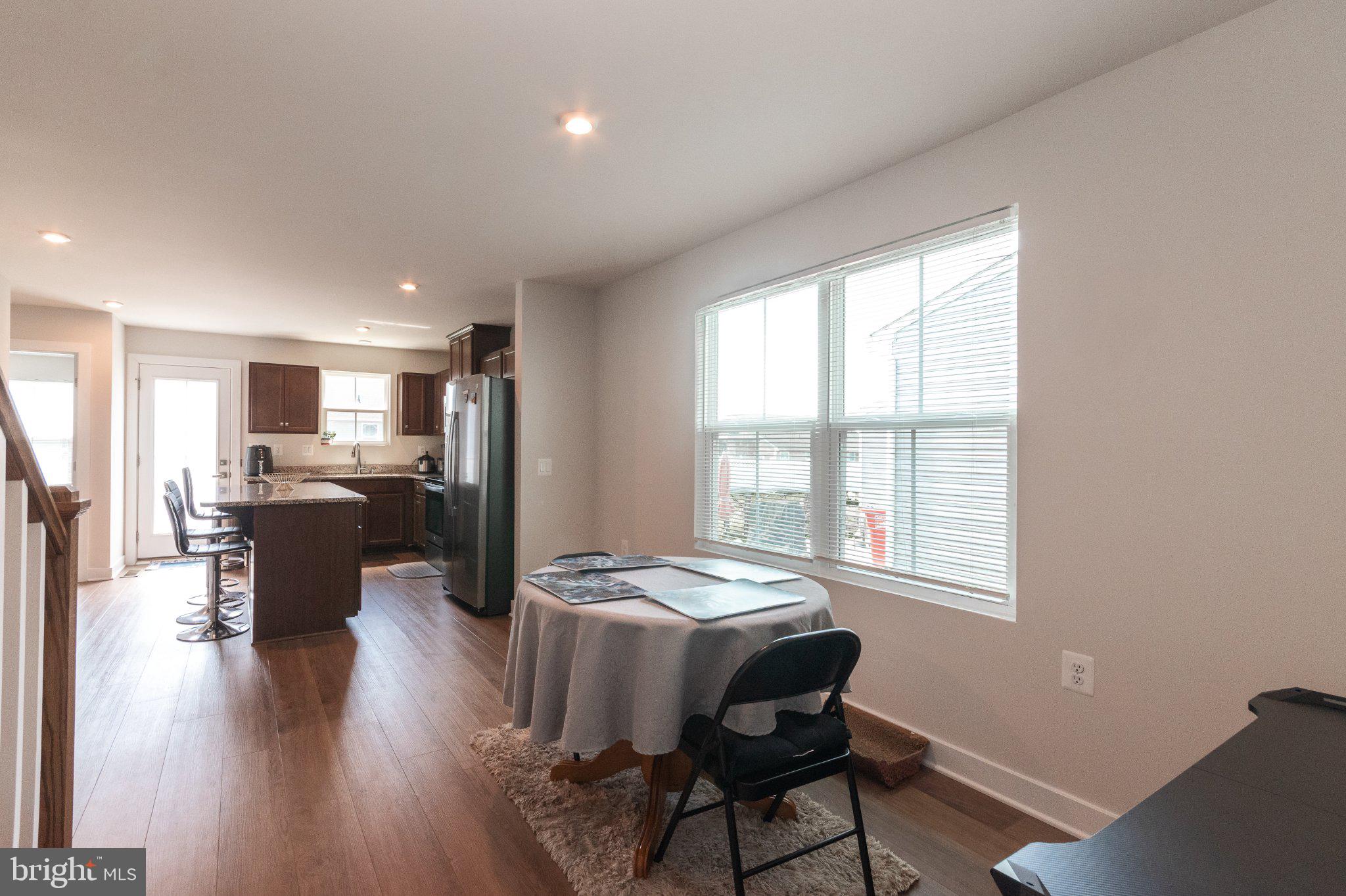 109 Blantons Road Martinsburg, WV 25405 - Photo 14 of 55 a view of a dining room with furniture window and wooden floor
