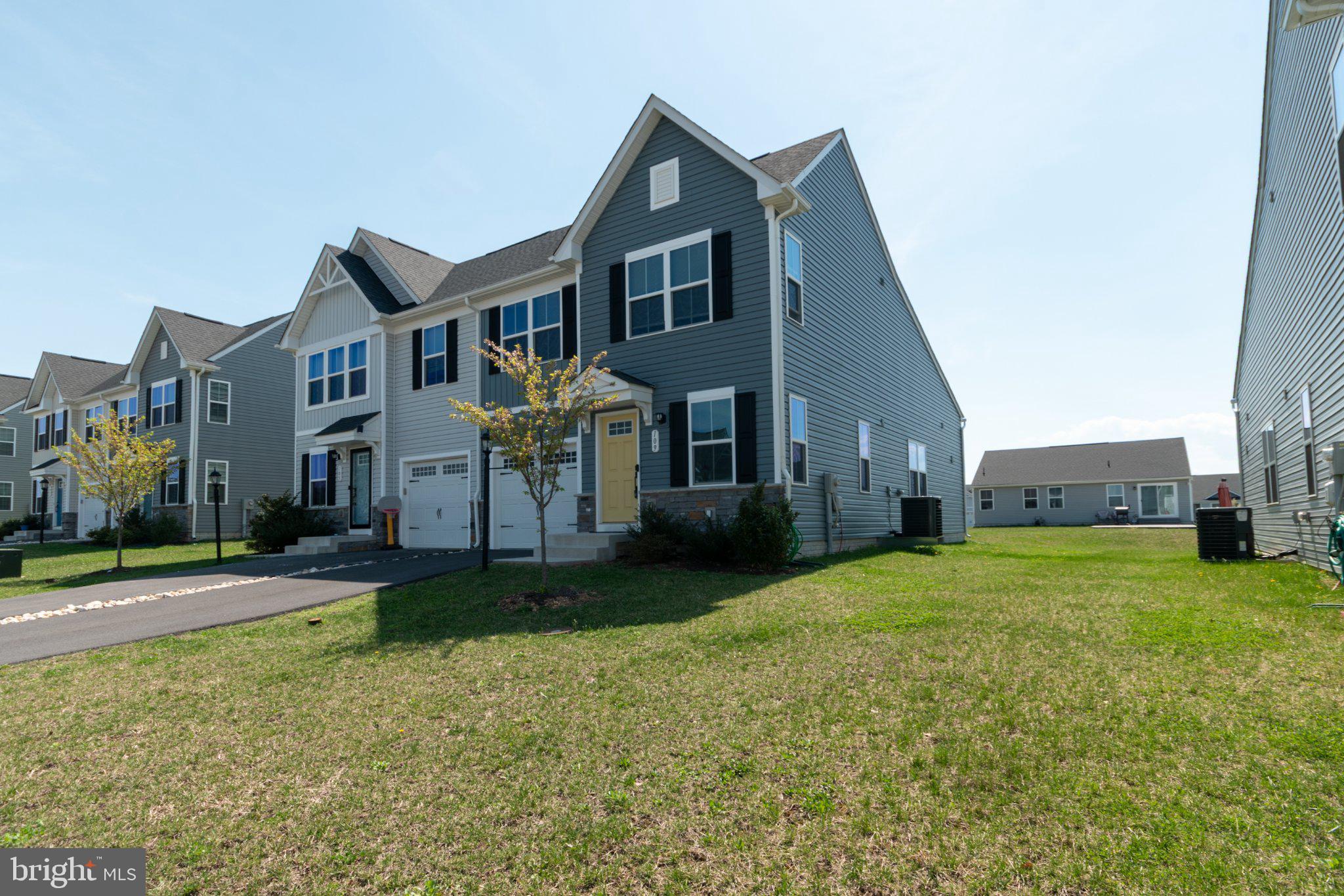 109 Blantons Road Martinsburg, WV 25405 - Photo 3 of 55 a front view of a house with a yard and garage