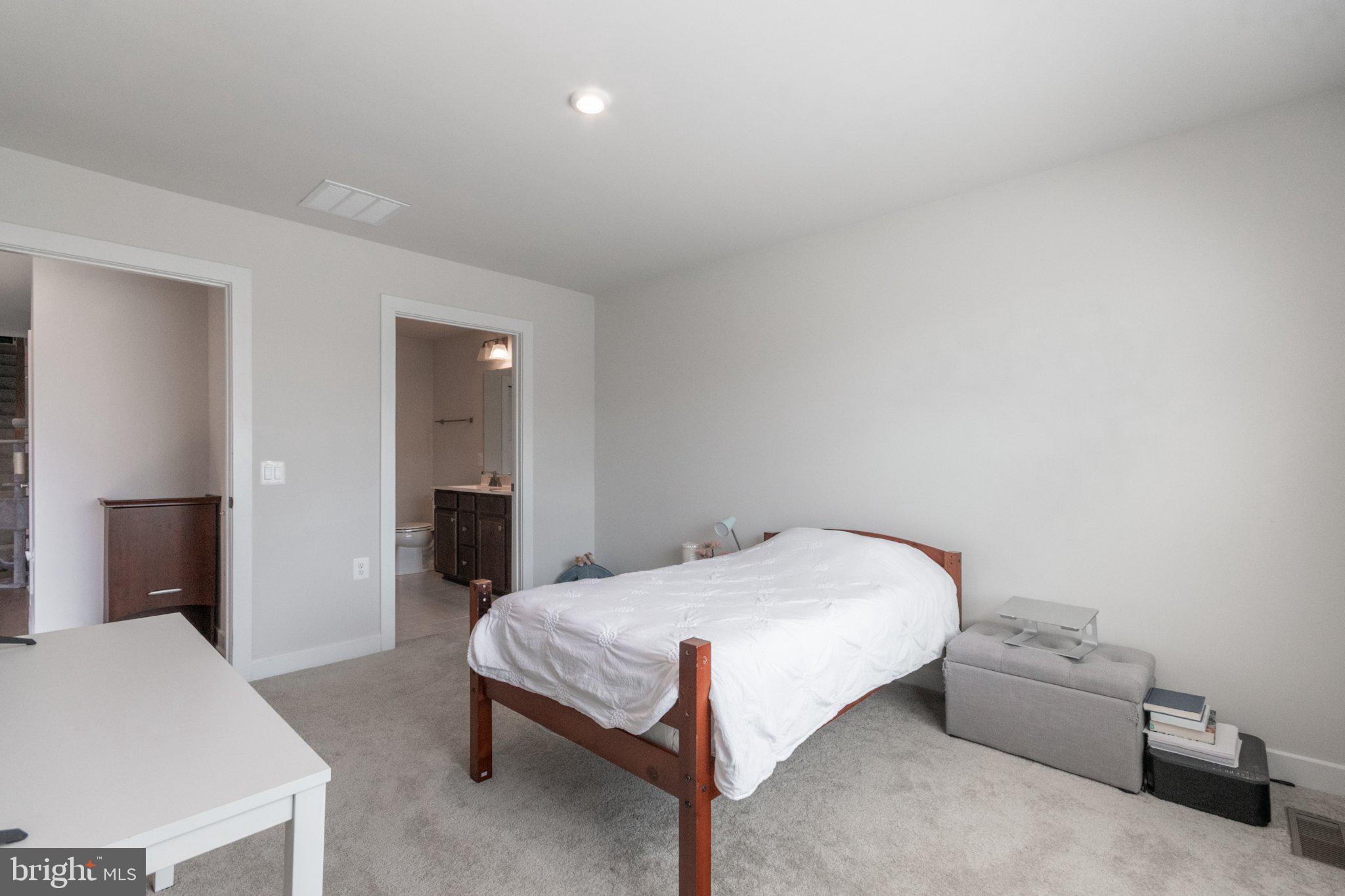 109 Blantons Road Martinsburg, WV 25405 - Photo 31 of 55 a bedroom with a bed and a table