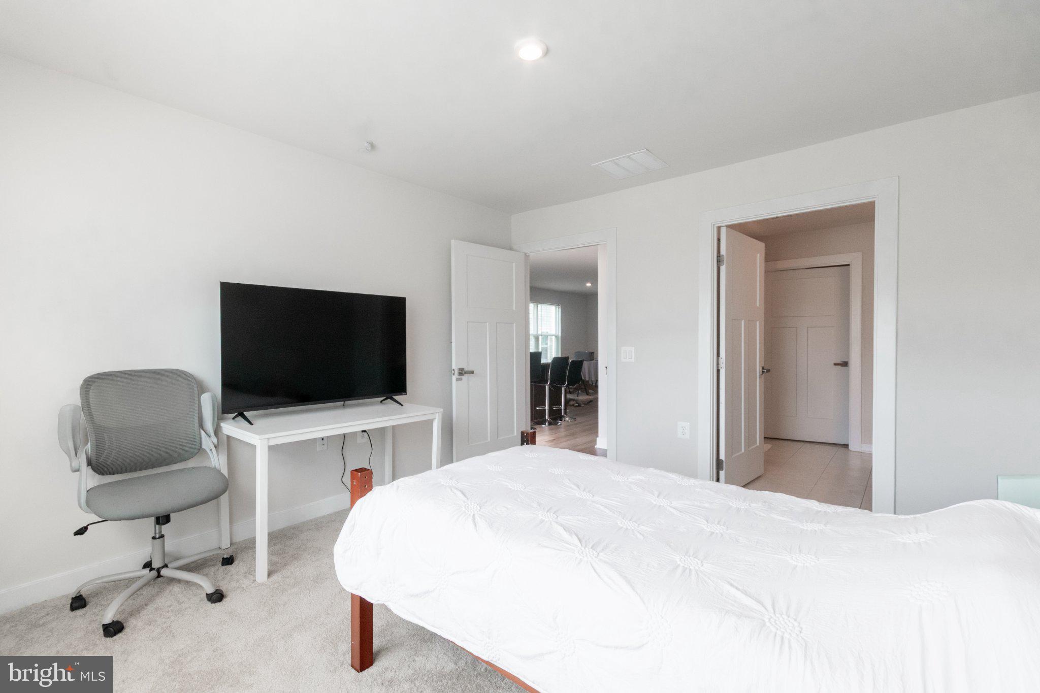 109 Blantons Road Martinsburg, WV 25405 - Photo 32 of 55 a bedroom with a bed and a flat screen tv