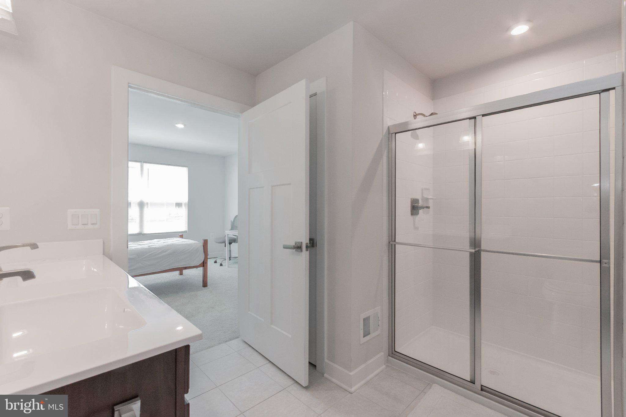 109 Blantons Road Martinsburg, WV 25405 - Photo 35 of 55 a bathroom with a bathtub a sink a mirror and a shower