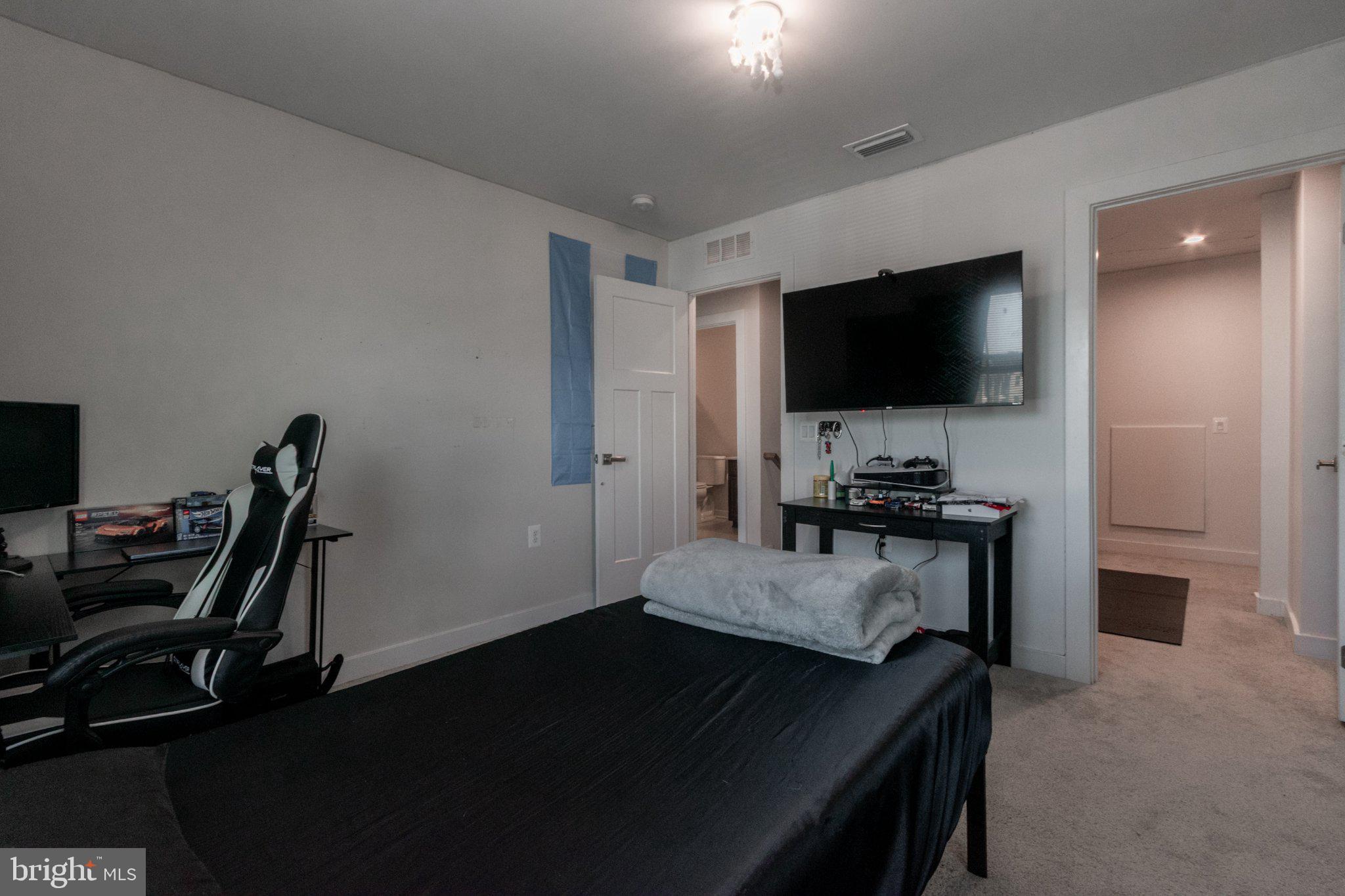 109 Blantons Road Martinsburg, WV 25405 - Photo 39 of 55 a living room with furniture and a flat screen tv