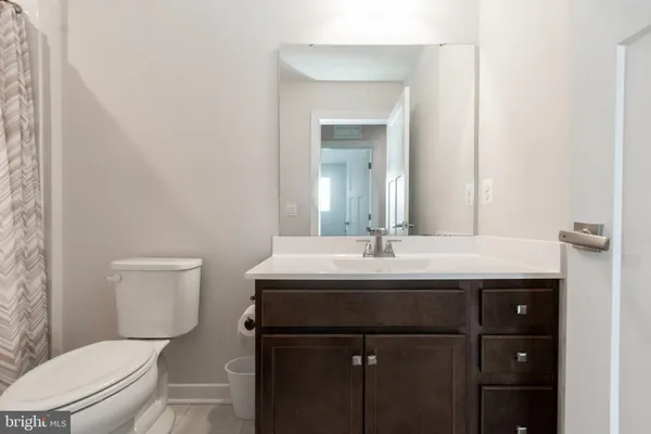 a bedroom with a bed and cabinets