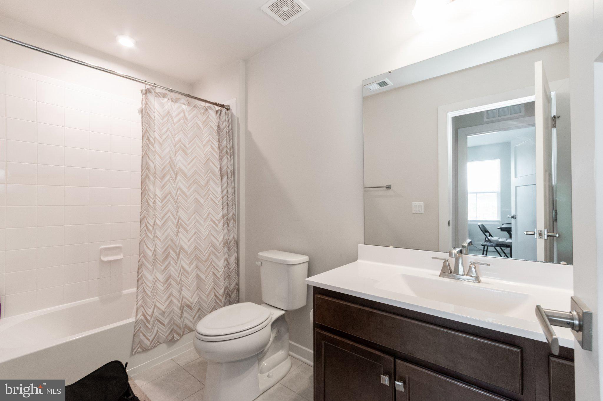 109 Blantons Road Martinsburg, WV 25405 - Photo 43 of 55 a bathroom with a sink a toilet a mirror and shower