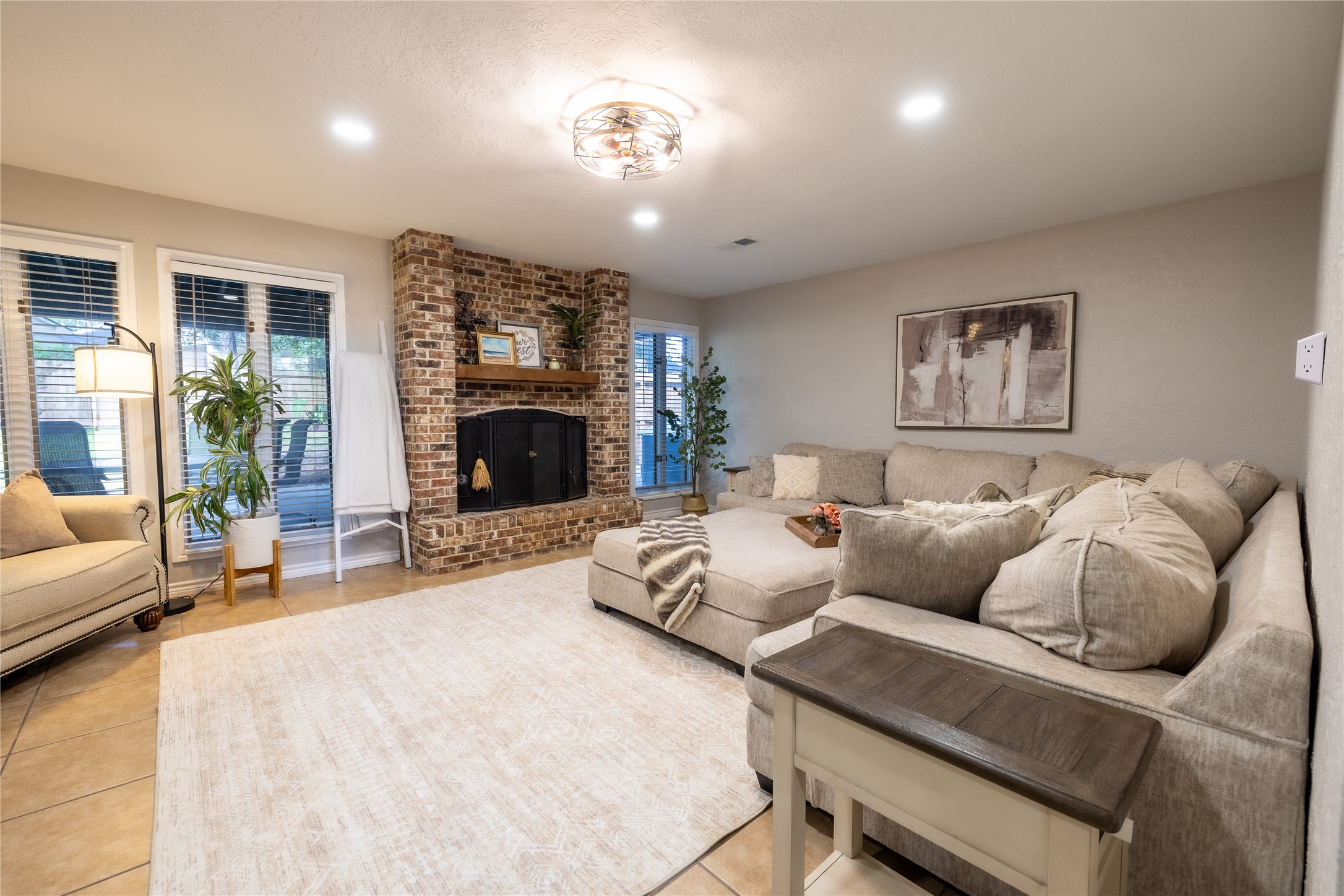 144 Lake View Circle Montgomery, TX 77356 - Photo 17 of 31 a bed room with furniture and a fireplace