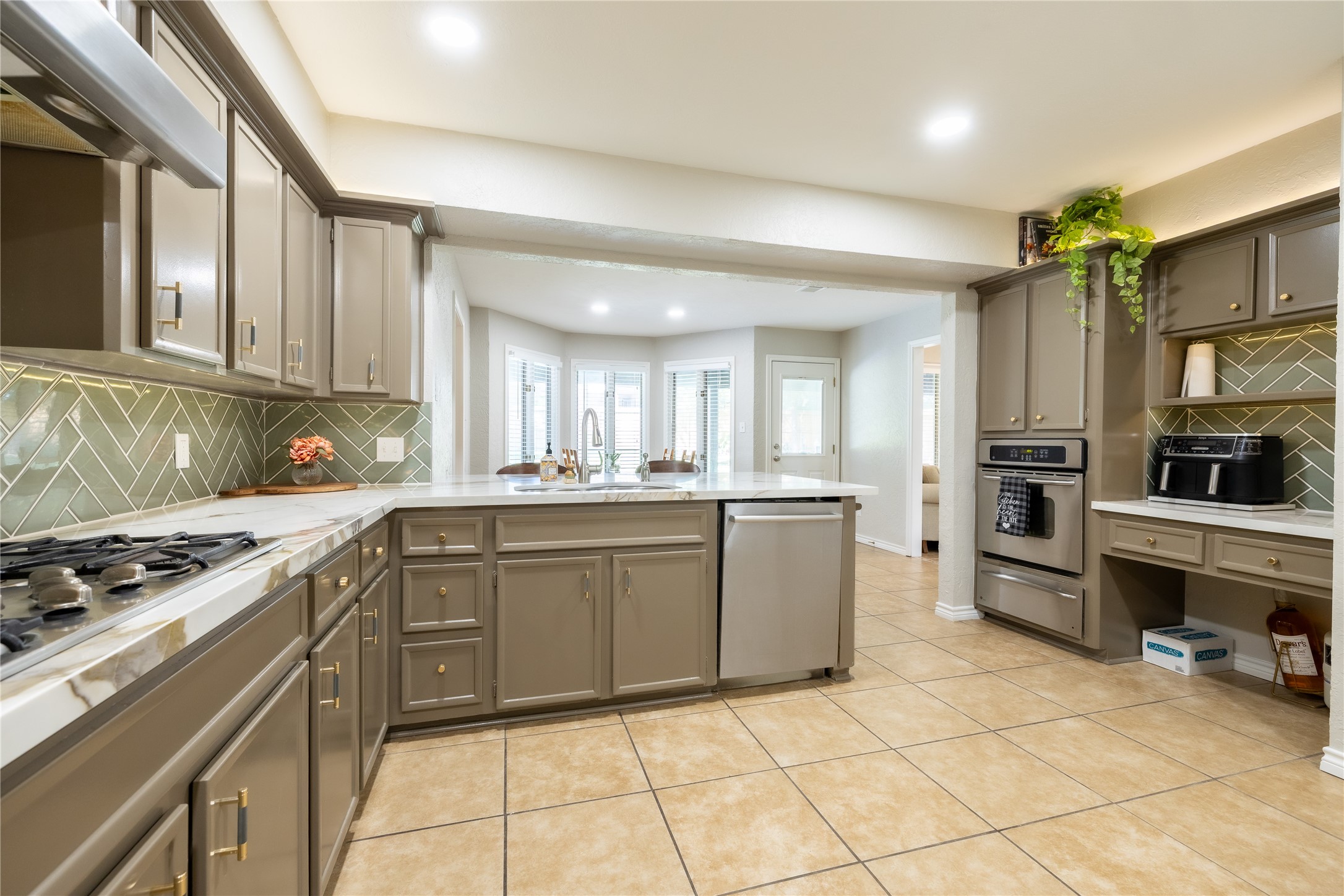 144 Lake View Circle Montgomery, TX 77356 - Photo 23 of 31 a kitchen with granite countertop a sink cabinets and stainless steel appliances