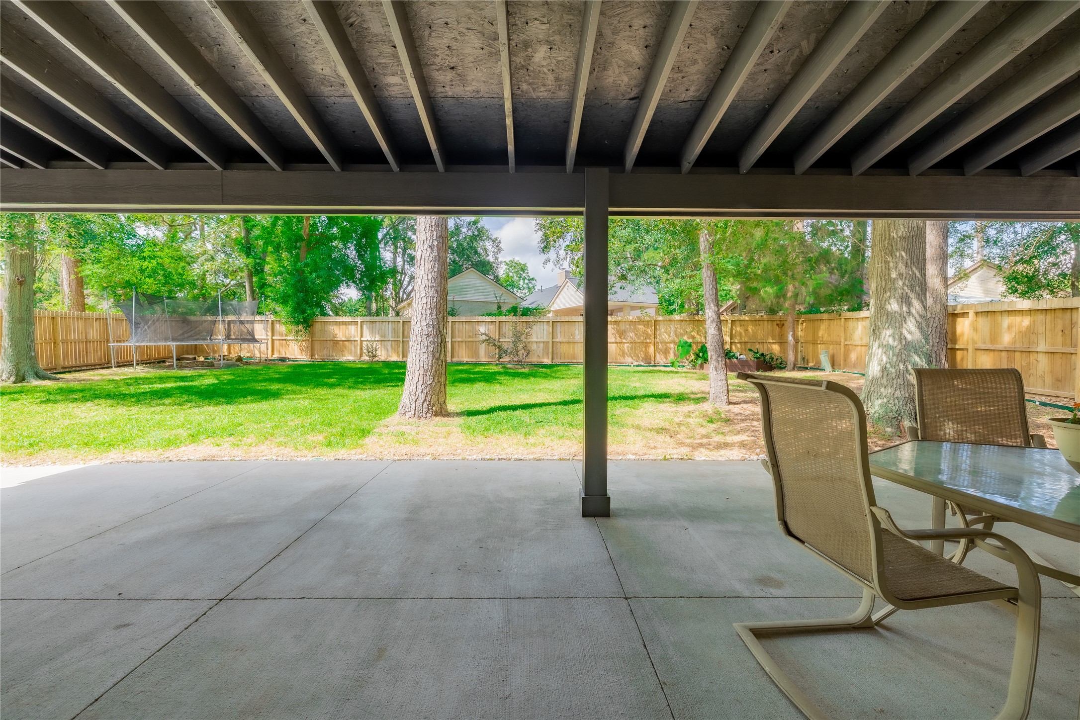 144 Lake View Circle Montgomery, TX 77356 - Photo 26 of 31 a view of a porch with chairs and backyard