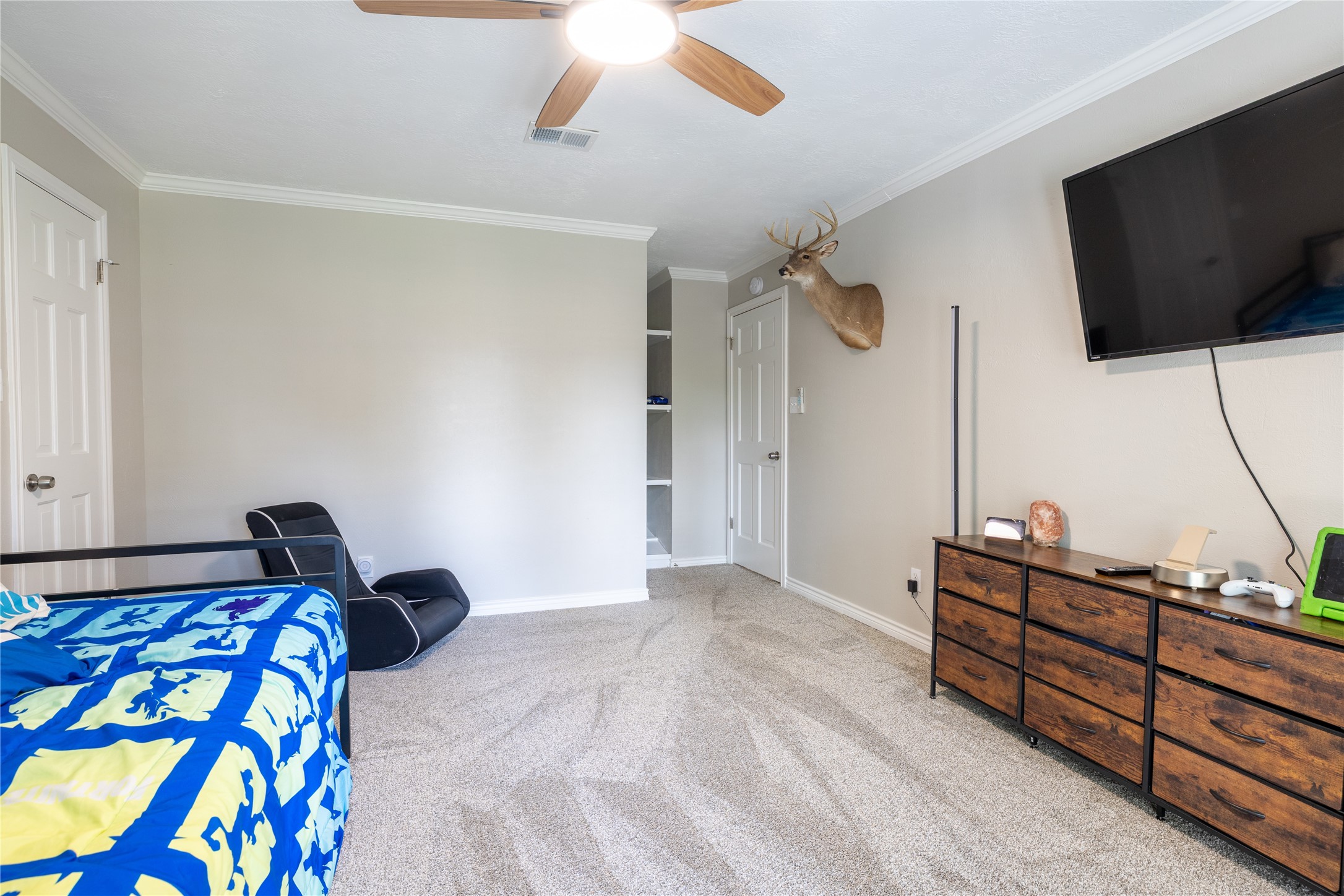 144 Lake View Circle Montgomery, TX 77356 - Photo 8 of 31 a bedroom with a bed and flat screen tv