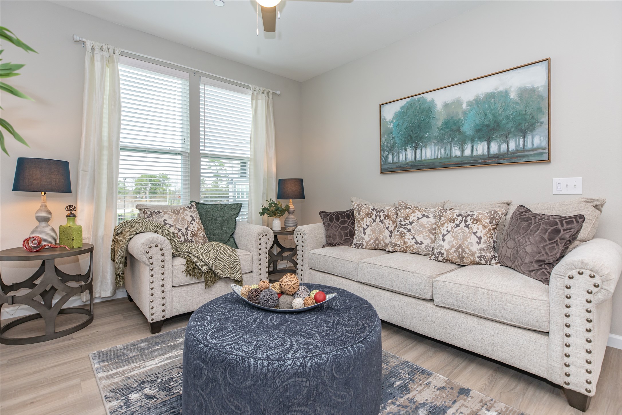 14809 Ralston Road, Unit A18302 Humble, TX 77396 - Photo 7 of 16 a living room with furniture a table and a large window
