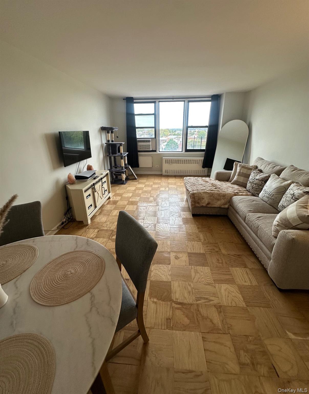 3121 Middletown Road, Unit 6H Bronx, NY 10461 - Photo 12 of 24 a living room with furniture and a window