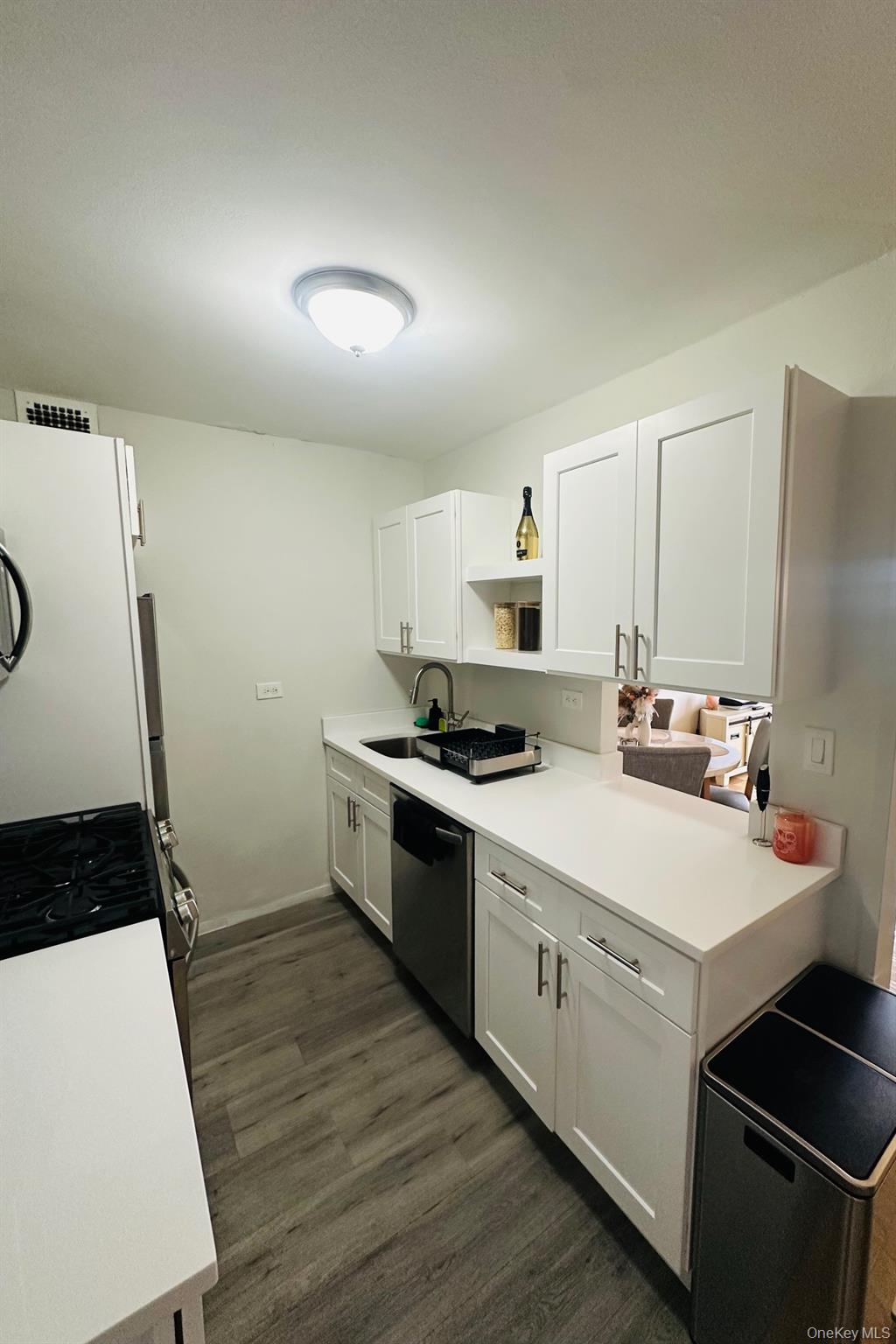 3121 Middletown Road, Unit 6H Bronx, NY 10461 - Photo 15 of 24 a kitchen with a sink a stove and cabinets