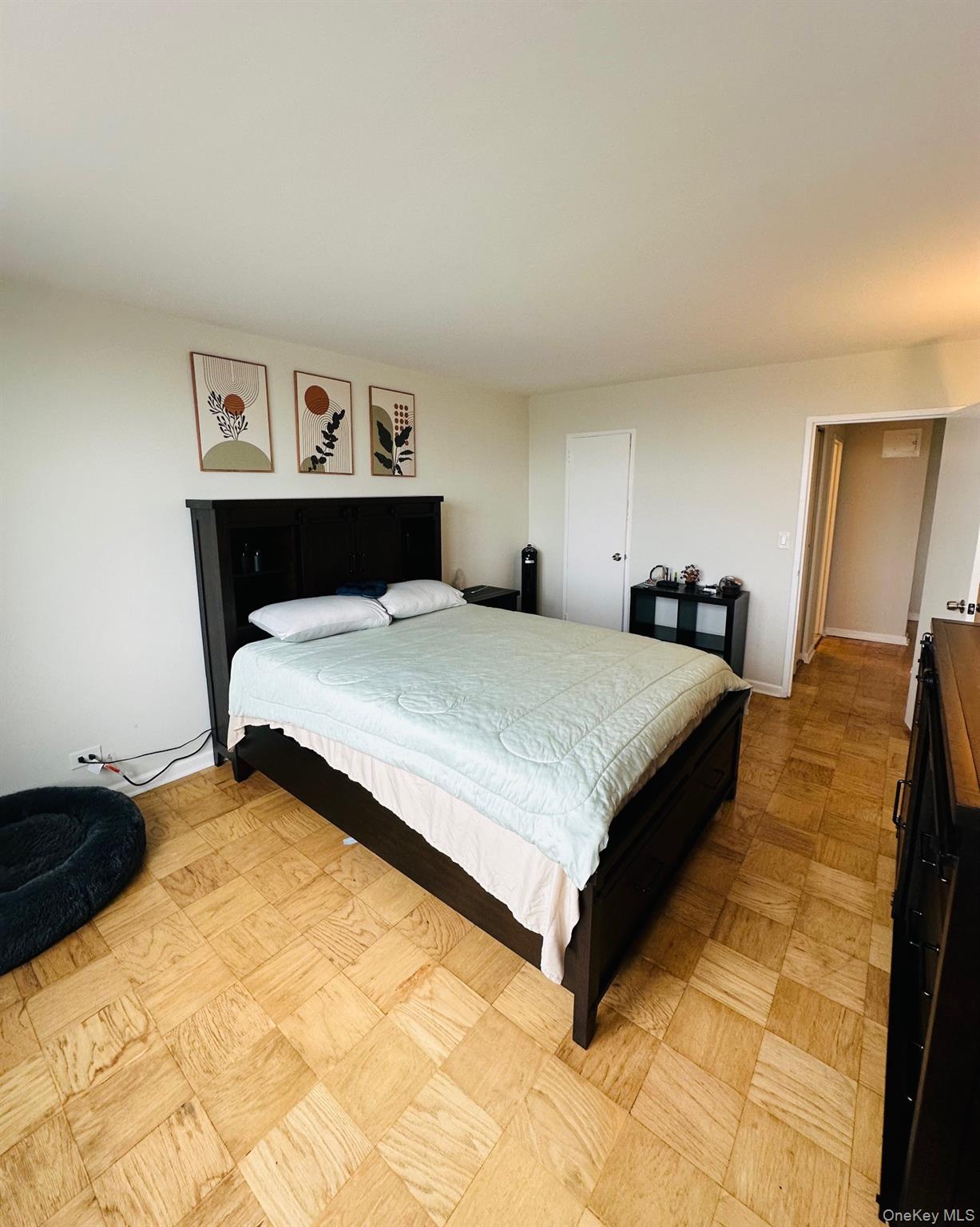 3121 Middletown Road, Unit 6H Bronx, NY 10461 - Photo 19 of 24 a bedroom with a bed and dresser