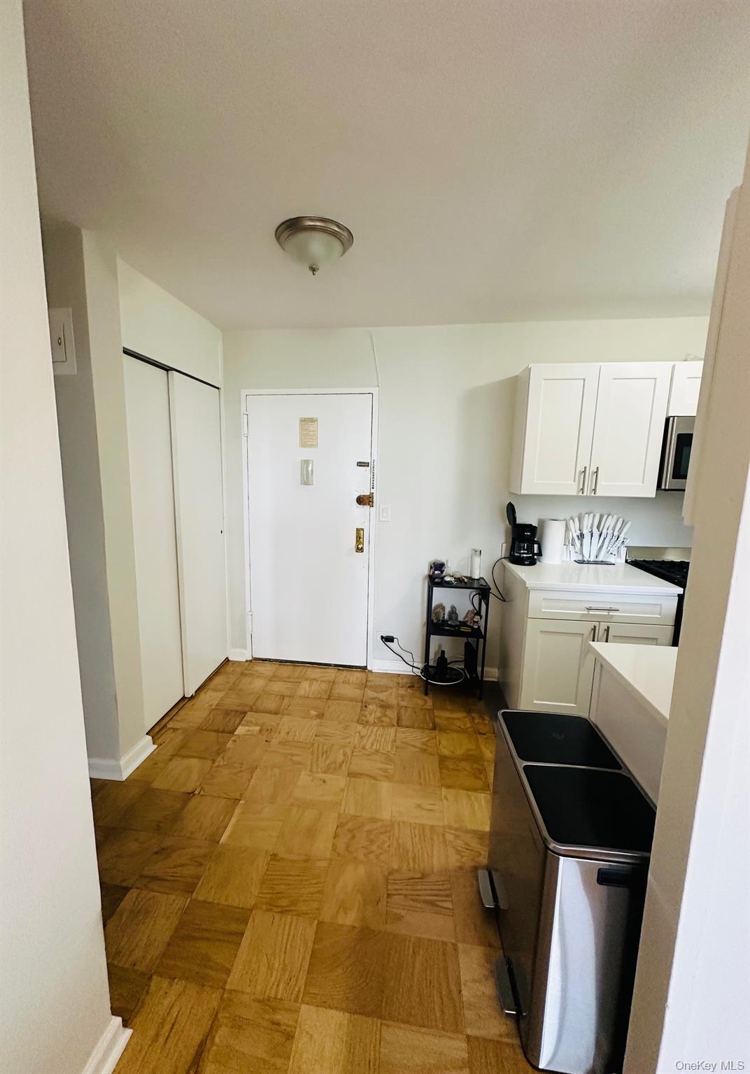 3121 Middletown Road, Unit 6H Bronx, NY 10461 - Photo 9 of 24 a bedroom with a bed and a view of kitchen