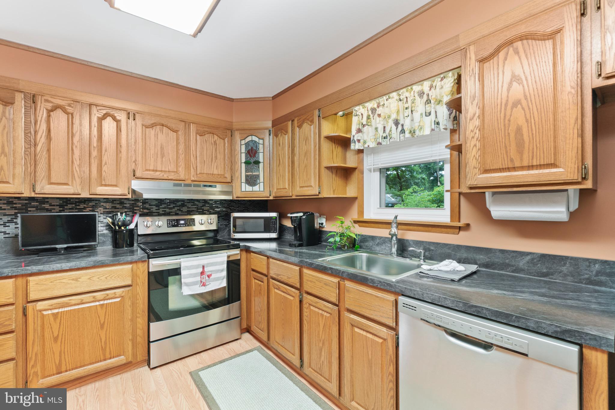 815 Lucky Road Severn, MD 21144 - Photo 13 of 40 Oak cabinets with window overlooking back yard