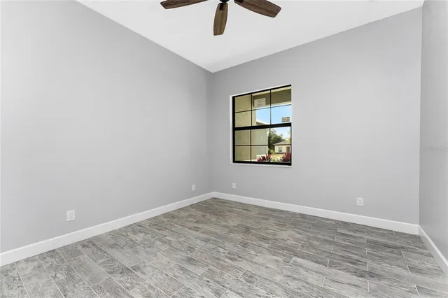 a bathroom with a toilet and bathtub