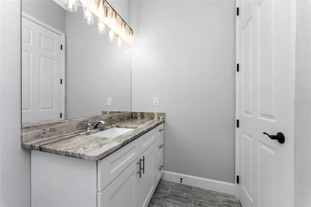 a view of small space with wooden floor and windows