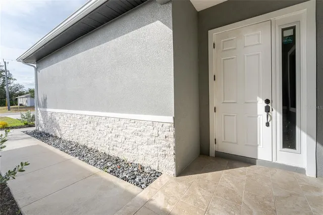 a view of a kitchen with a sink and cabinets