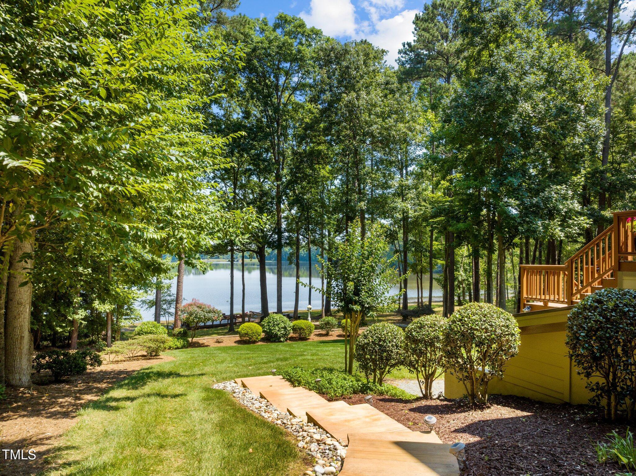901 Edgewater Drive Garner, NC 27529 - Photo 1 of 72 a view of a yard with plants and large trees