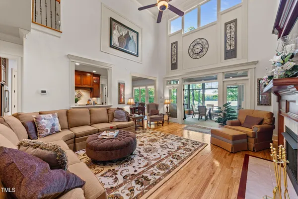 a dining room with furniture a rug and a large window