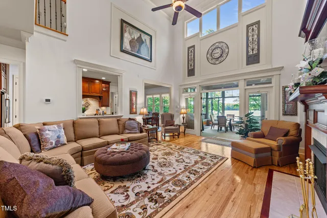 a dining room with furniture a rug and a large window