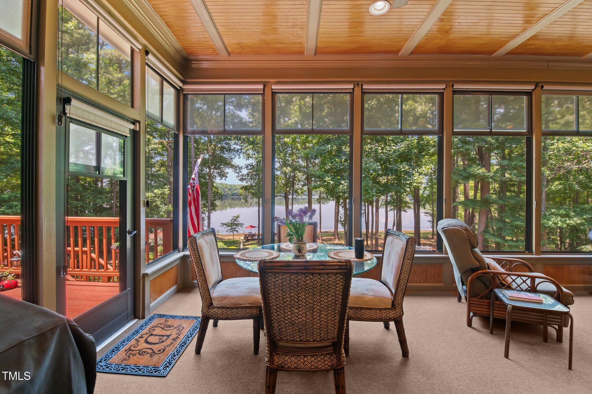 901 Edgewater Drive Garner, NC 27529 - Photo 13 of 72 a dining room with furniture a rug and a large window