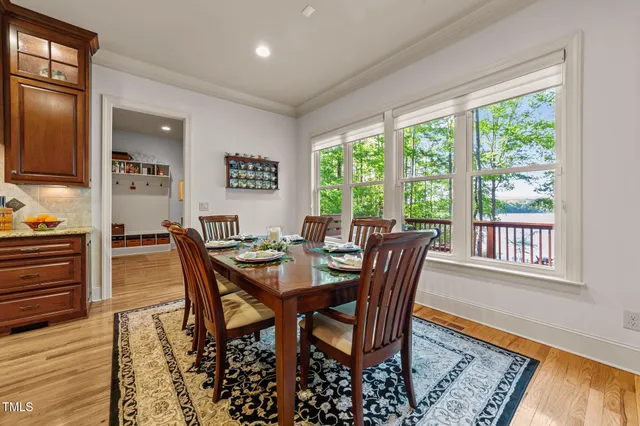 a view of an entryway and hall with wooden floor