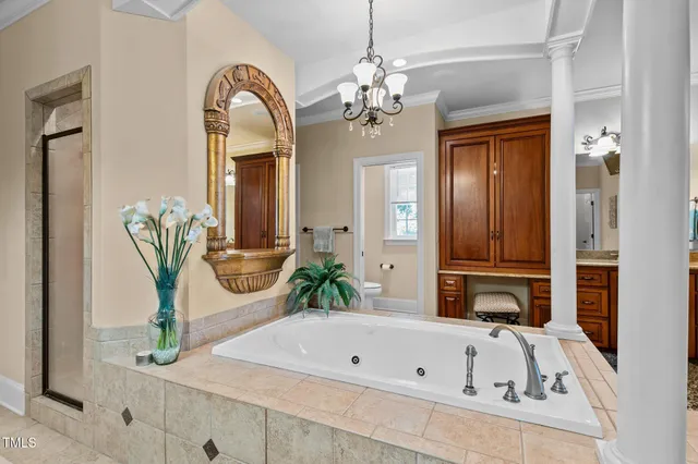 a view of a dining room with furniture wooden floor and chandelier