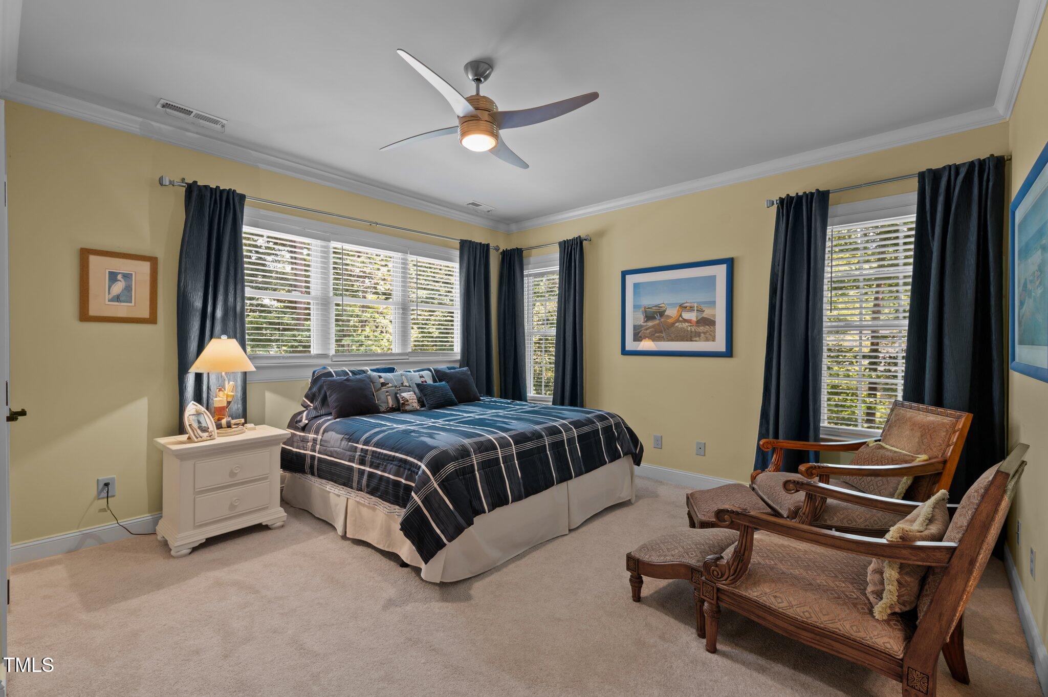901 Edgewater Drive Garner, NC 27529 - Photo 36 of 72 a living room with a bed furniture and a window