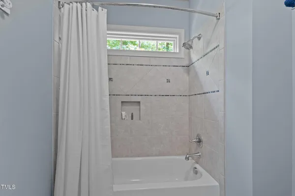 a room with furniture pool table and flat screen tv