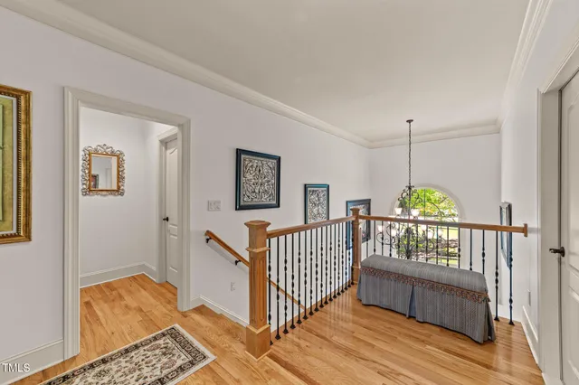 a media room with lots of chairs and a chandelier