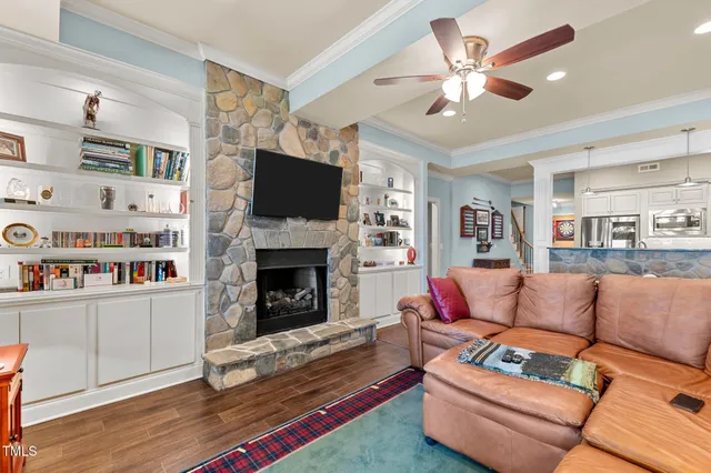 a bathroom with a granite countertop sink and a toilet