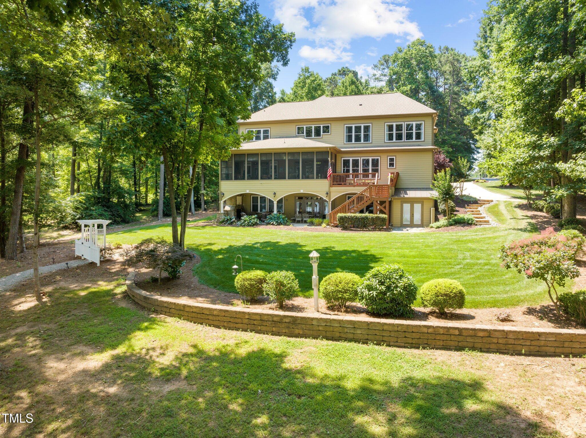 901 Edgewater Drive Garner, NC 27529 - Photo 58 of 72 a view of a house with a yard balcony and sitting area