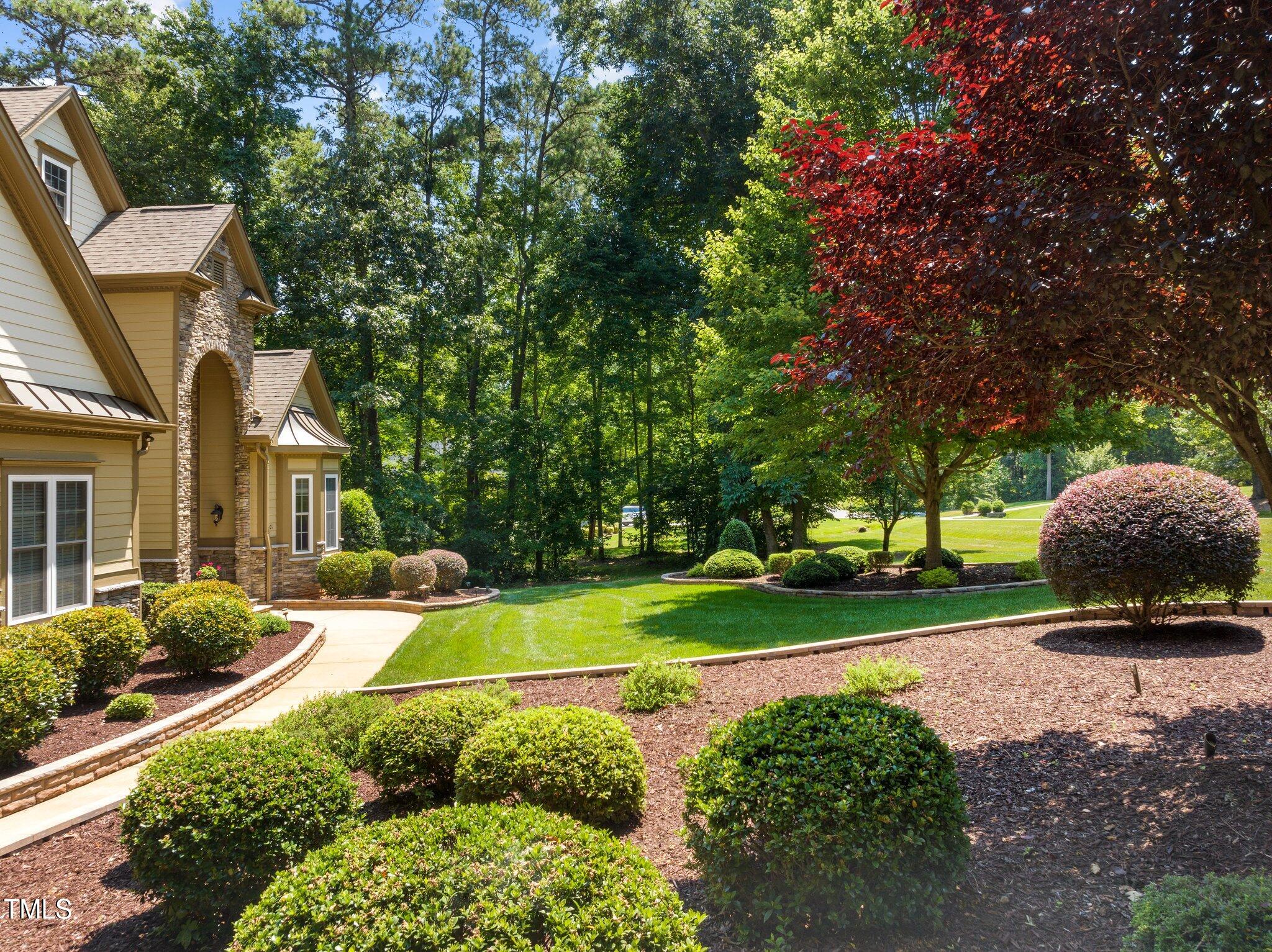 901 Edgewater Drive Garner, NC 27529 - Photo 60 of 72 a view of a house with a big yard and large trees
