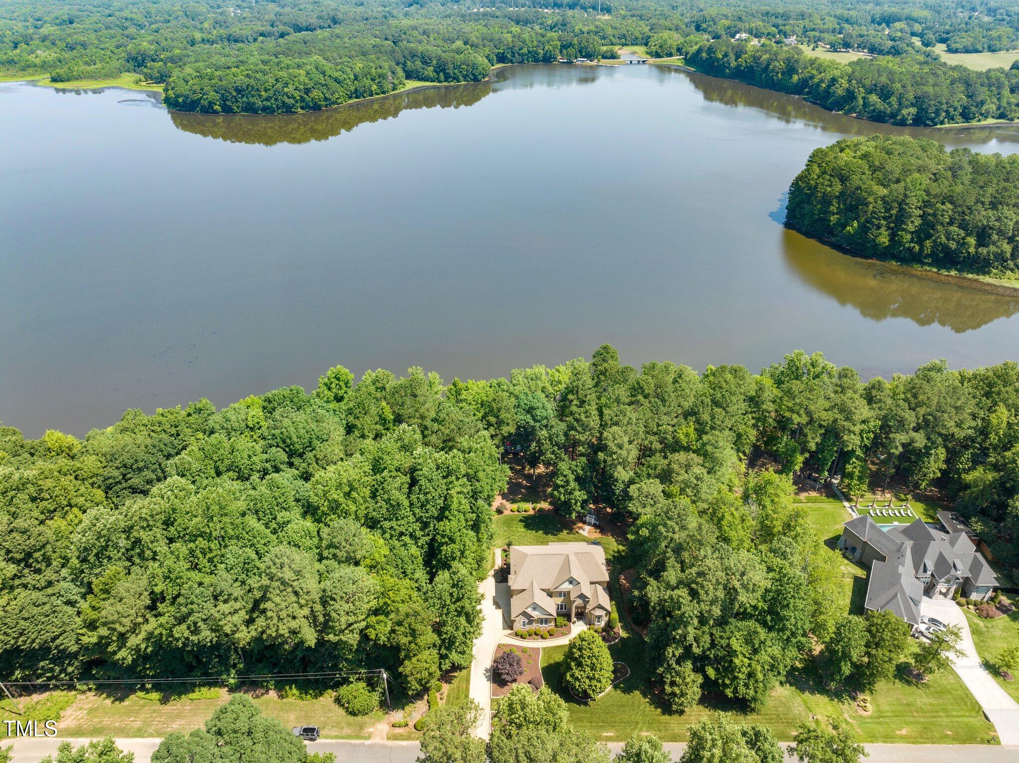 901 Edgewater Drive Garner, NC 27529 - Photo 4 of 72 an aerial view of a residential houses with outdoor space and lake view
