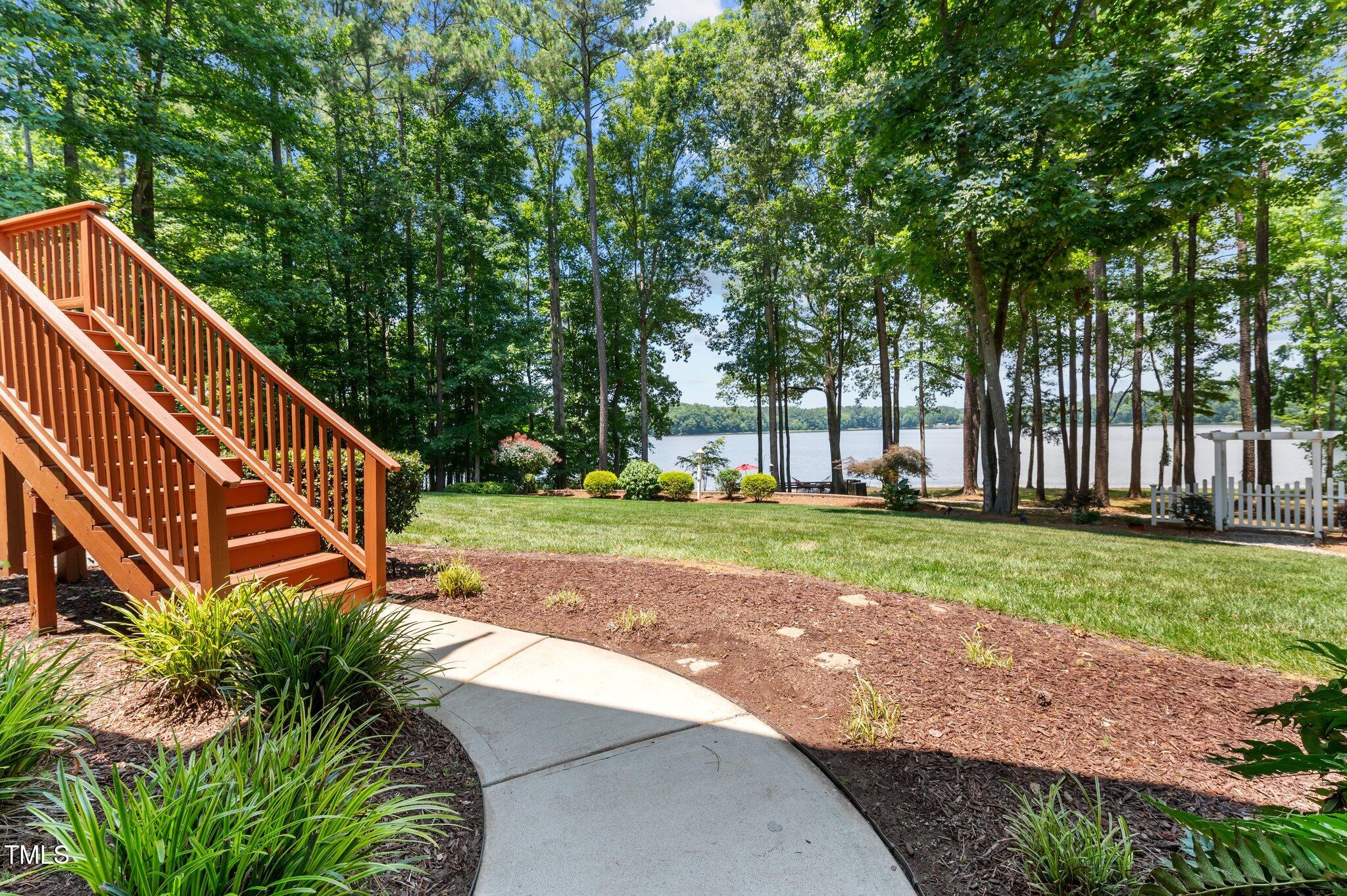 901 Edgewater Drive Garner, NC 27529 - Photo 68 of 72 a view of a yard with plants and trees beside of it