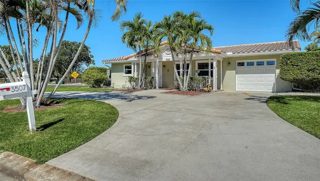 front view of a house with a garden