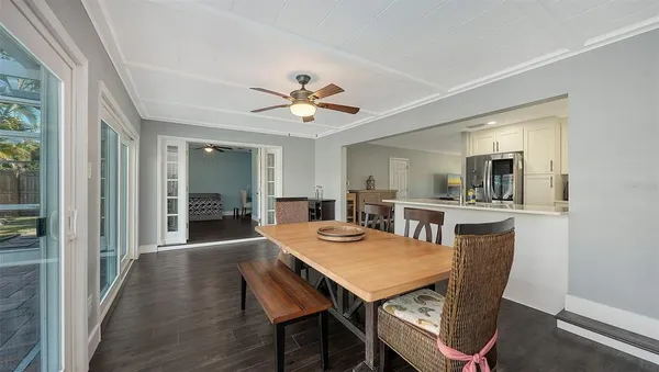 a view of a dining room with furniture and wooden floor