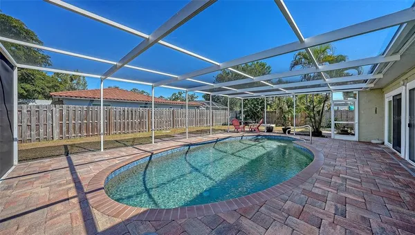 a view of a swimming pool with a patio