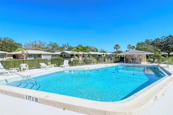 a view of a swimming pool with a patio