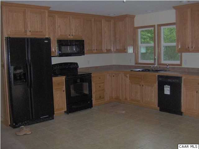 621 Buffalo Road Dillwyn, VA 23936 - Photo 4 of 6 a kitchen with a sink and a refrigerator