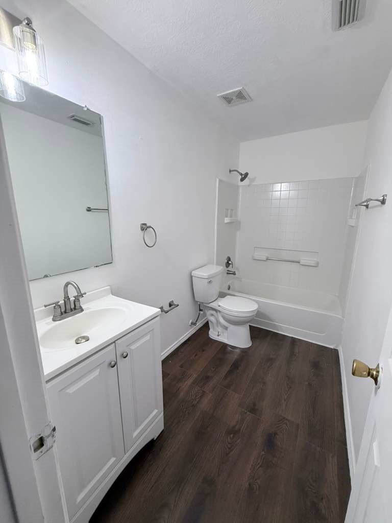 1011 Backland Court Spring, TX 77373 - Photo 22 of 35 a bathroom with a toilet sink and mirror