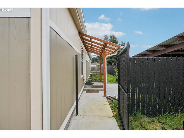 a view of a porch with wooden floor and stairs