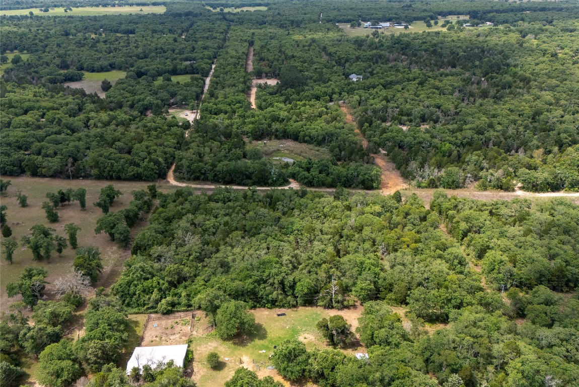 Tbd Whipperwill Lane Elgin, TX 78621 - Photo 19 of 19 an aerial view of residential house with outdoor space and trees all around