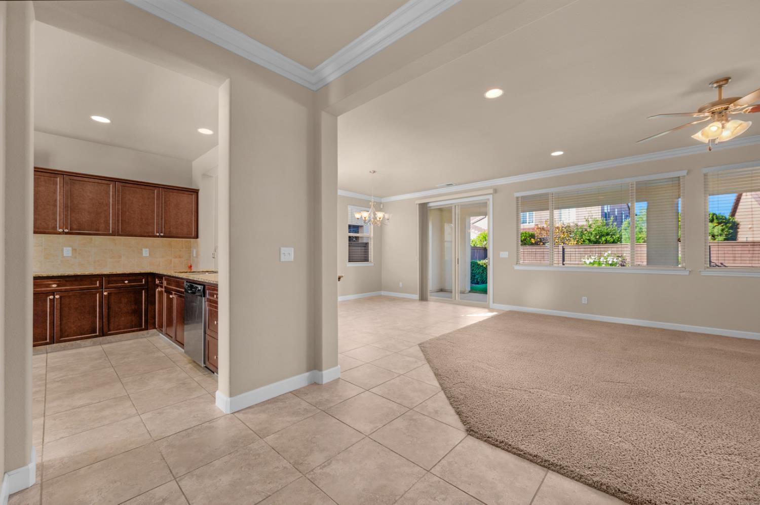3267 Portals Avenue Clovis, CA 93619 - Photo 16 of 69 a view of a kitchen with a sink and a refrigerator