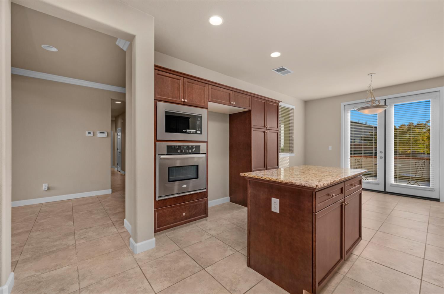 3267 Portals Avenue Clovis, CA 93619 - Photo 27 of 69 a kitchen with a stove and a refrigerator