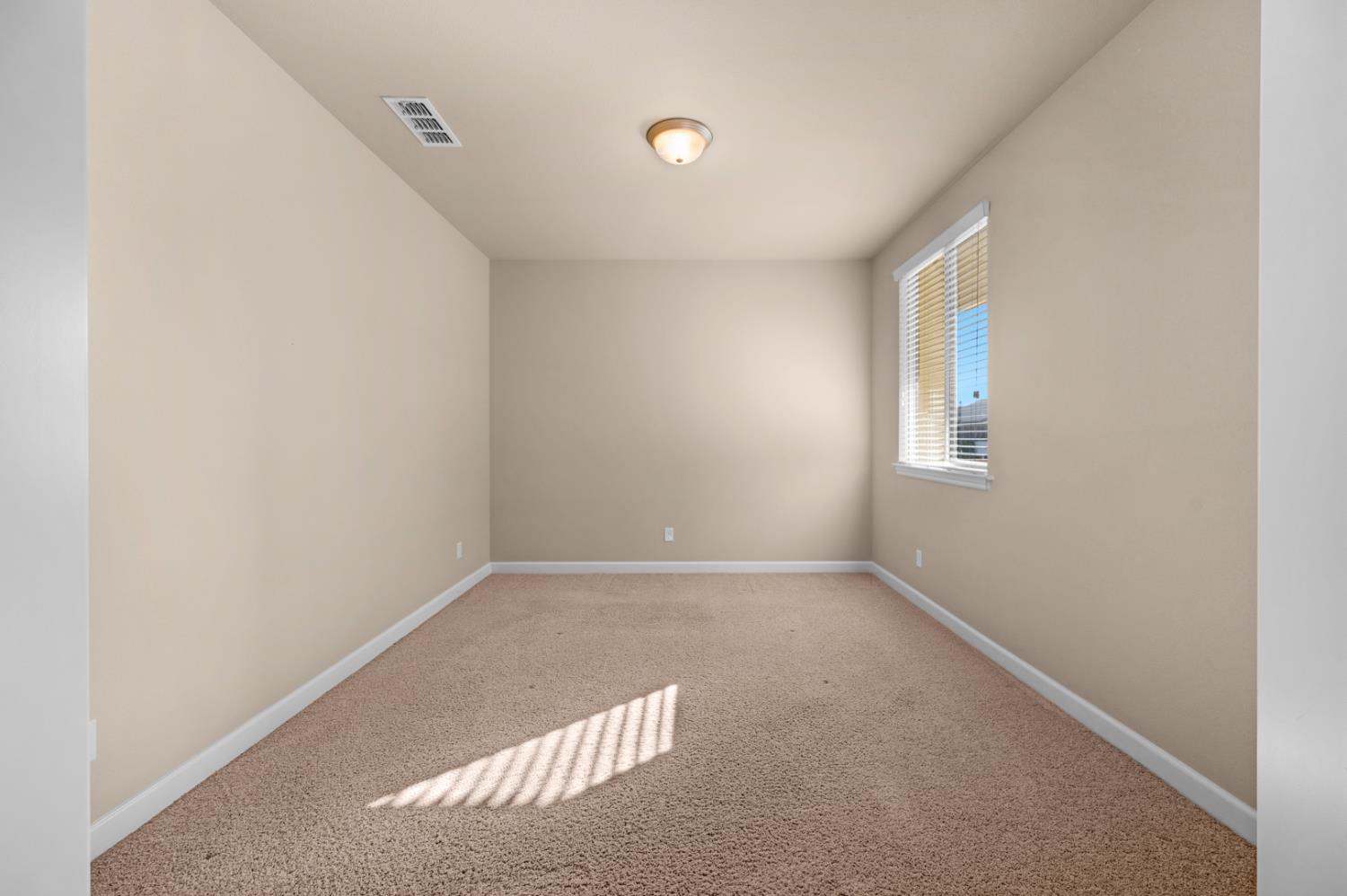 3267 Portals Avenue Clovis, CA 93619 - Photo 35 of 69 an empty room with windows