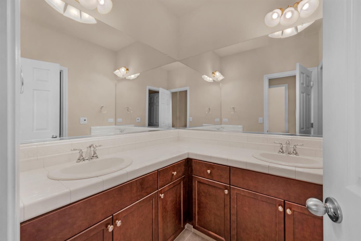 3267 Portals Avenue Clovis, CA 93619 - Photo 37 of 69 a bathroom with a sink double vanity and a mirror