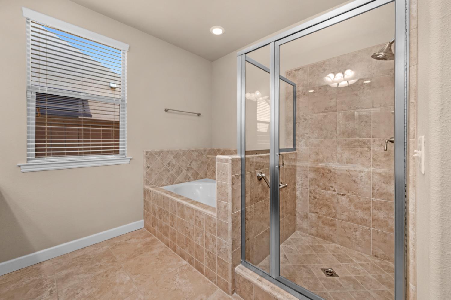 3267 Portals Avenue Clovis, CA 93619 - Photo 46 of 69 a bathroom with a shower and a sink