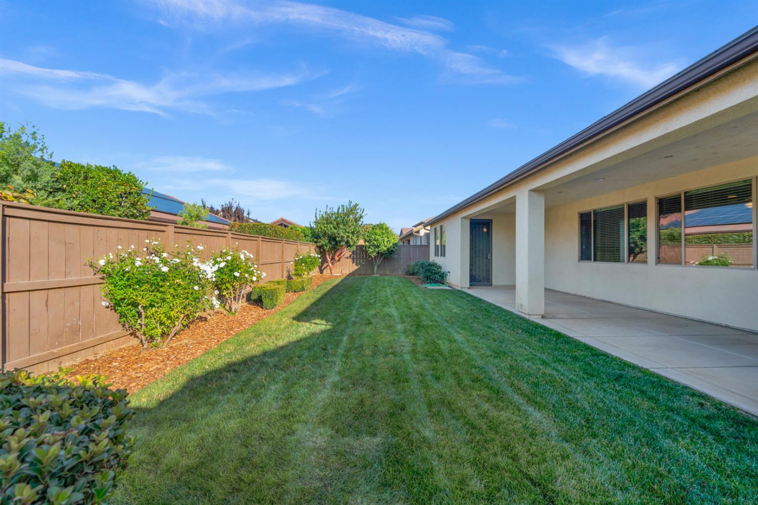 3267 Portals Avenue Clovis, CA 93619 - Photo 55 of 69 a view of a backyard with plants and a garden